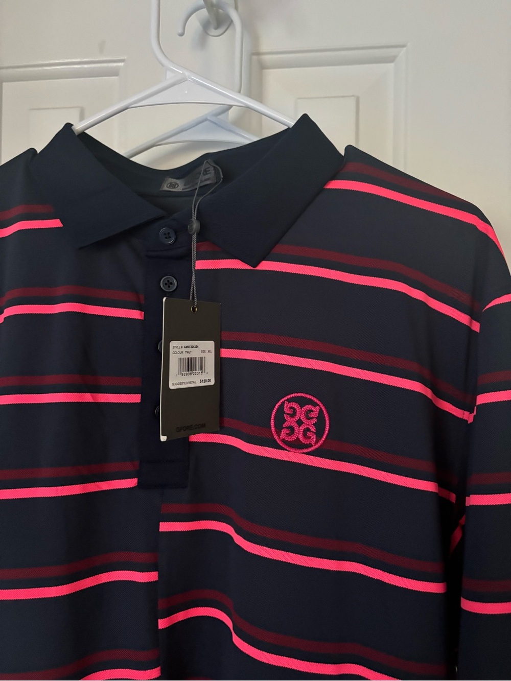 G/FORE Navy Polo with Pink Stripe Detailing